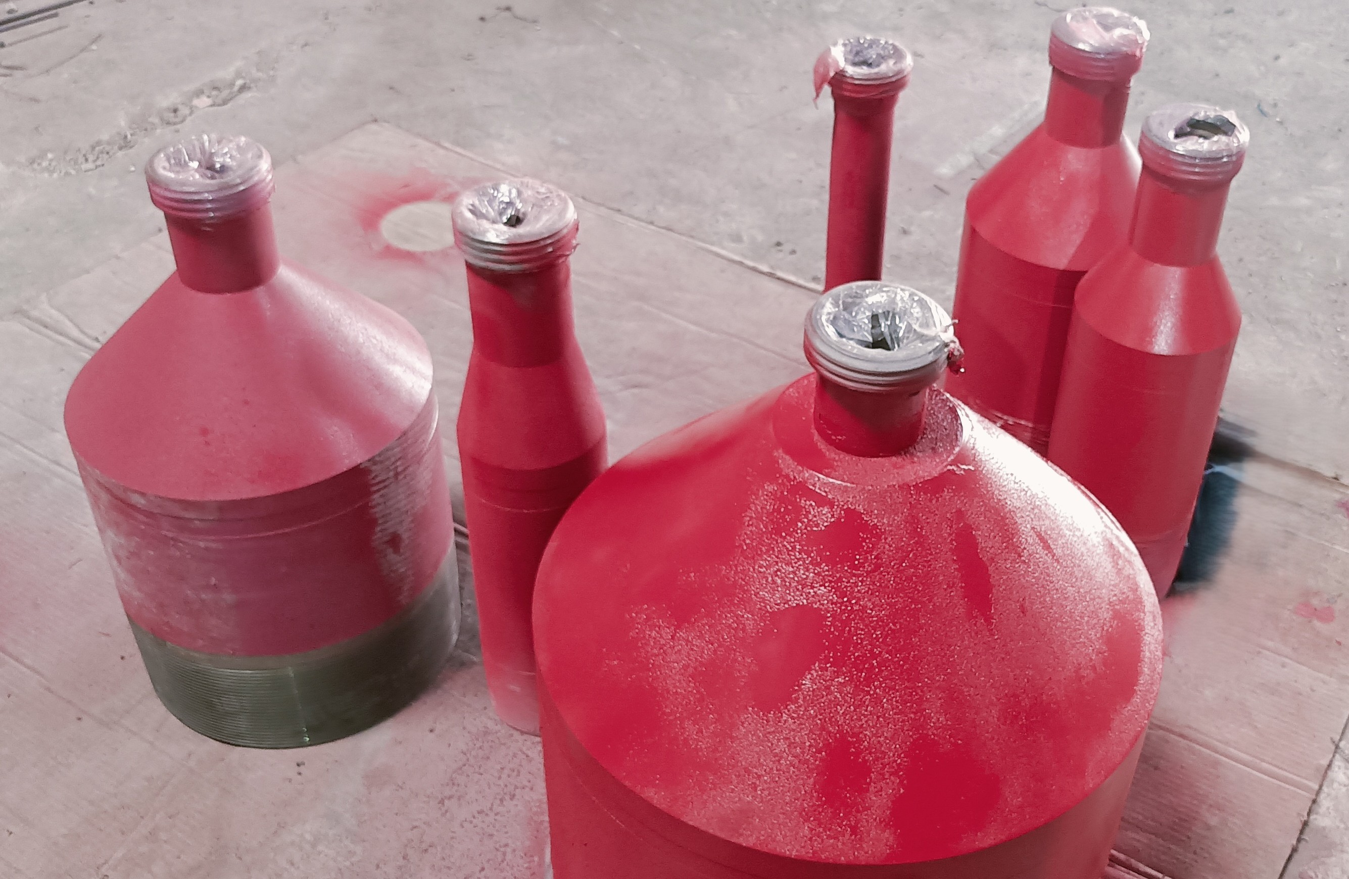 Integral casing circulating heads finished in red protective coating